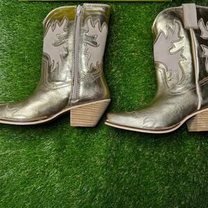 Very volatile gold metallic cowboy